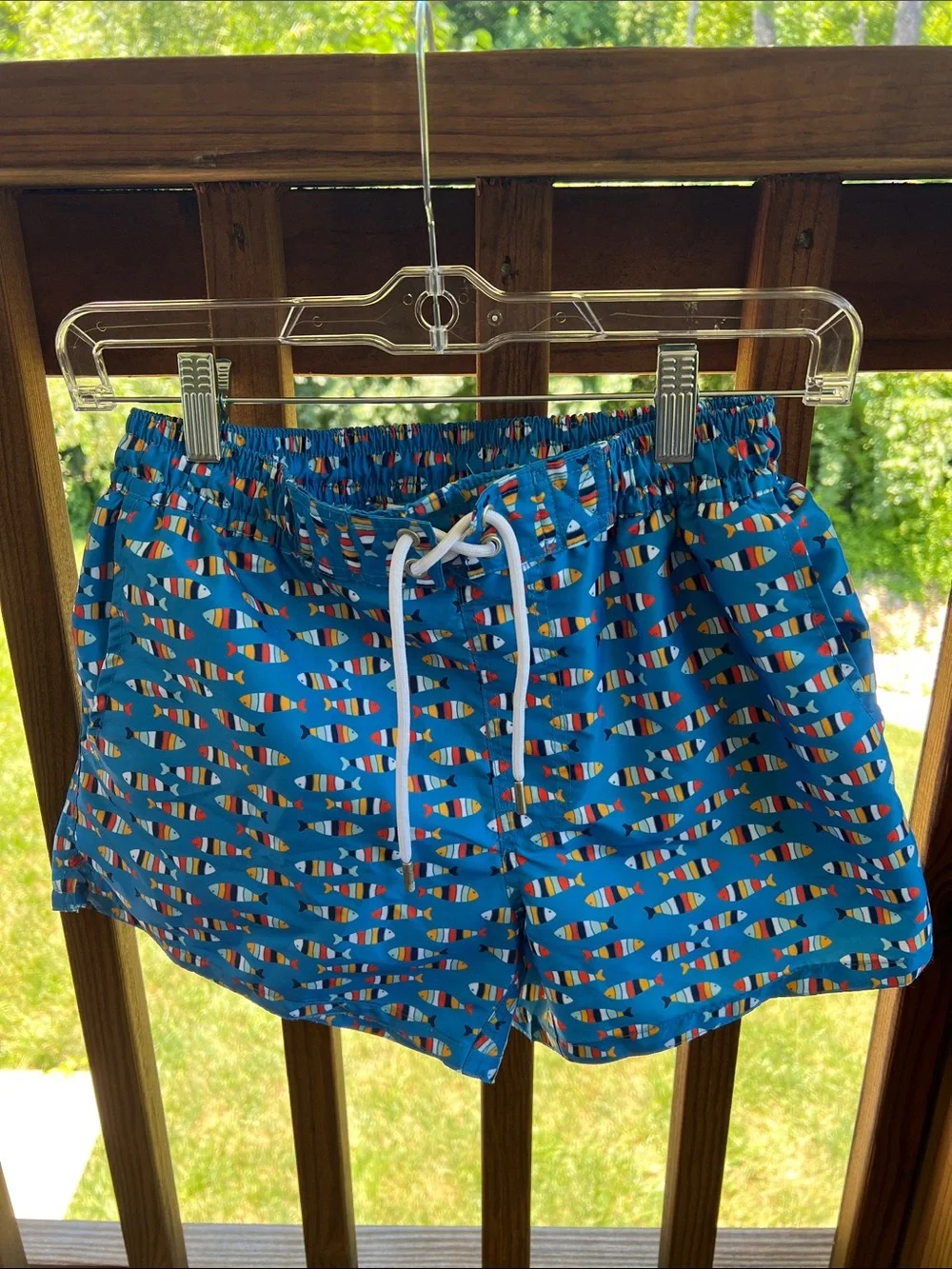 Tailored, men’s swim trunks with all over fish pattern